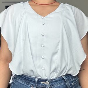 light blue frilled top