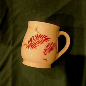 White Medium Size Coffee Mug With Leaf Print .