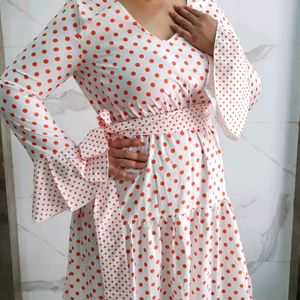 Three tiered orange polka print white dress