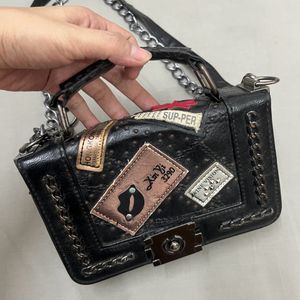 Punched Black Sling Bag.