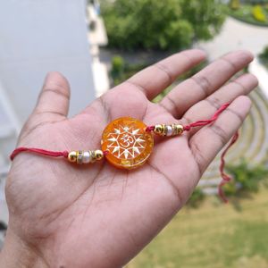 Orange Om Resin Rakhi