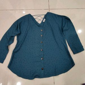 Blue Top With Black Buttons And Design On Back.