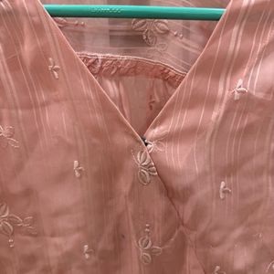 A Pretty Peach Top With Delicate Embroidered Motif
