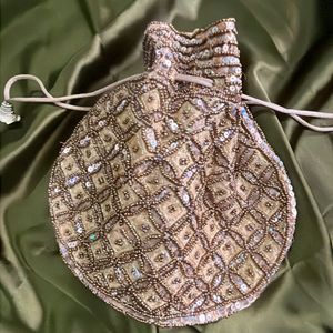 Beautiful zari embroidery Gold Potli Bag