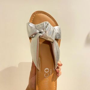 Bow Shaped Silver Flats