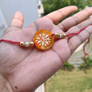 Orange Om Resin Rakhi