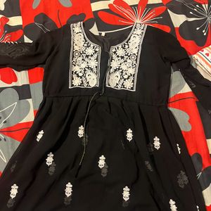 A Short Black Kurti With Work Of White Chikankari