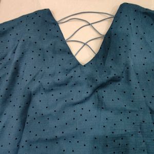 Blue Top With Black Buttons And Design On Back.