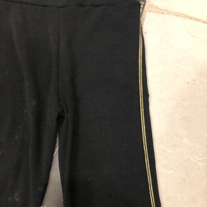 Black Leggings With Golden Striped Sides