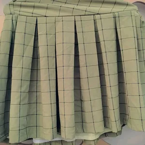 A beautiful korean style pleated skirt in oilive g