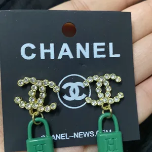 CHANEL GREEN LOCK EARRINGS