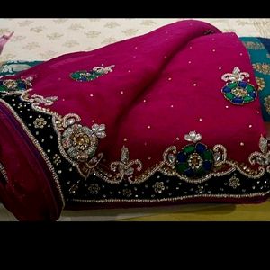 Beautiful heavy embroidered Rani pink saree