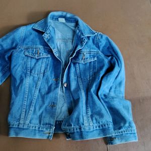 blue denim jacket with open buttons