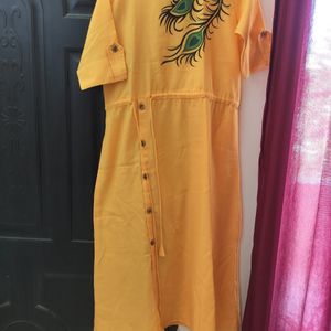 Yellow Morpankh Print Kurti With Tie Knots At Wais