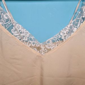 Cream Cami Top With Net Design On Neck.