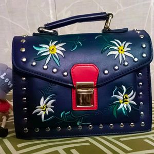 Women Solid Handbag With Beautiful Embroidery Work