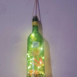 Bottle Lights With Flowers And Decorative Pieces