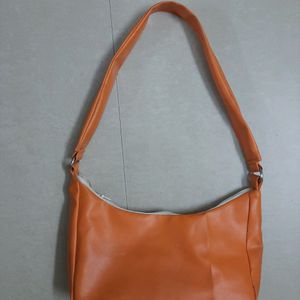 Orange shoulder baguette bag