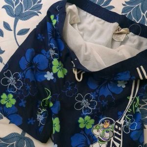 DISNEY Floral mens swimming Costume/ Beach Shorts