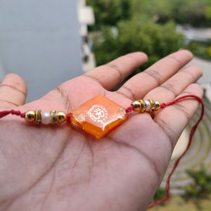 Orange Om Resin Rakhi