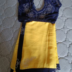 Shining Yellow Saree With Navy Blue Blouse