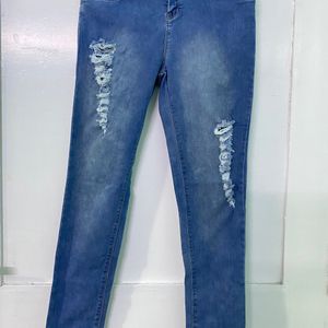 LIGHT BLUE RIPPED JEANS FOR WOMEN