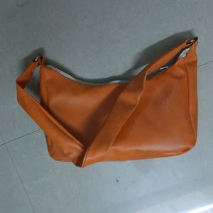 Orange shoulder baguette bag