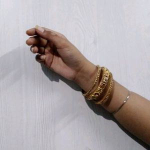 Set Of Three Bangles In Golden Color