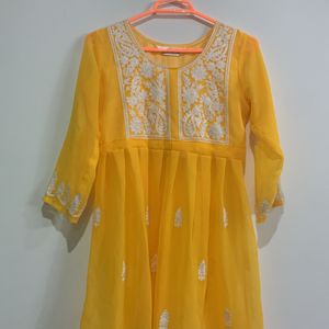 Yellow Kurti with half net and chikankari work