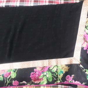 Black Saree With Thick border And Stitched Blouse.
