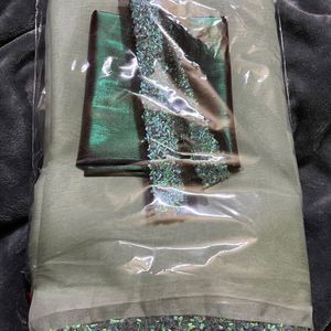 Pista green organza silk saree & contrast metallic