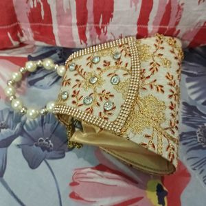 Small Clutch With Stone And Golden Embroidery Work