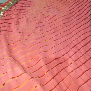 A Peach Colour Saree With Beutiful Red Strips