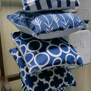 Five Cushions With Blue Cushion Cover