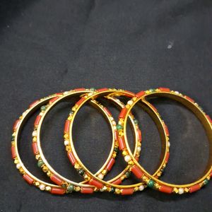 Beautiful coral and gold bangles Sz 2.8