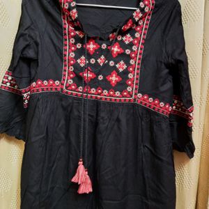 Embroidered Black Peplum Top