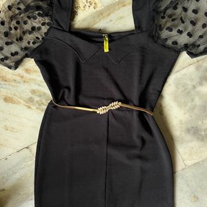 Black bodycon dress with puff sleeves