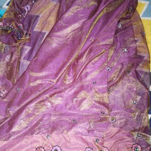 Net saree in purple colour havingg 2 shining shade