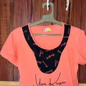 Orange colour Tshirt with pocket.