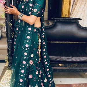 Green colour lehenga with back less blouse