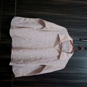 Pink chiffon shirt.