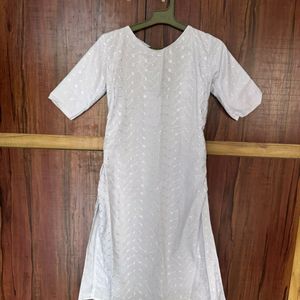 White coloured Stitched with floral Printed kurti.