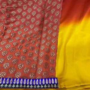 YELLOW ORANGE SHIFFON AND HEAVY EMBROIDERY SAREE