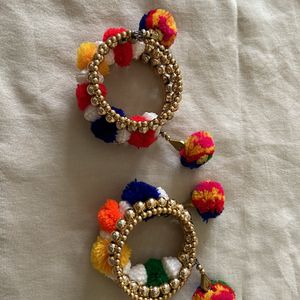 golden bracelets with pompom