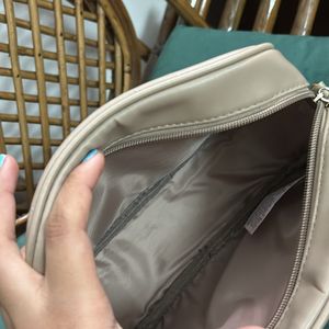 Miniso beige sling bag