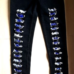 Black patterned skinny jeans