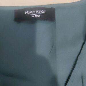 It's a Primo Knot Brand Shirt Style Top