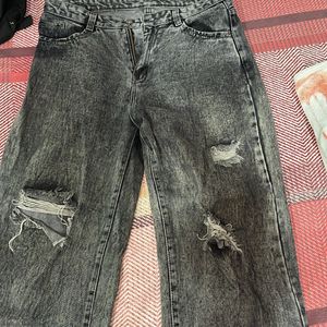 Acid washed distressed black oversized jeans