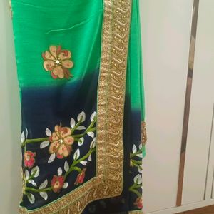 A Green Saree With Navy Blue Border