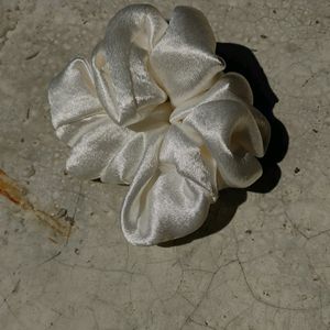 Shiny White Scrunchy Or Rubber Band.